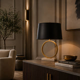 Modern designer table lamp with brass base and black shade