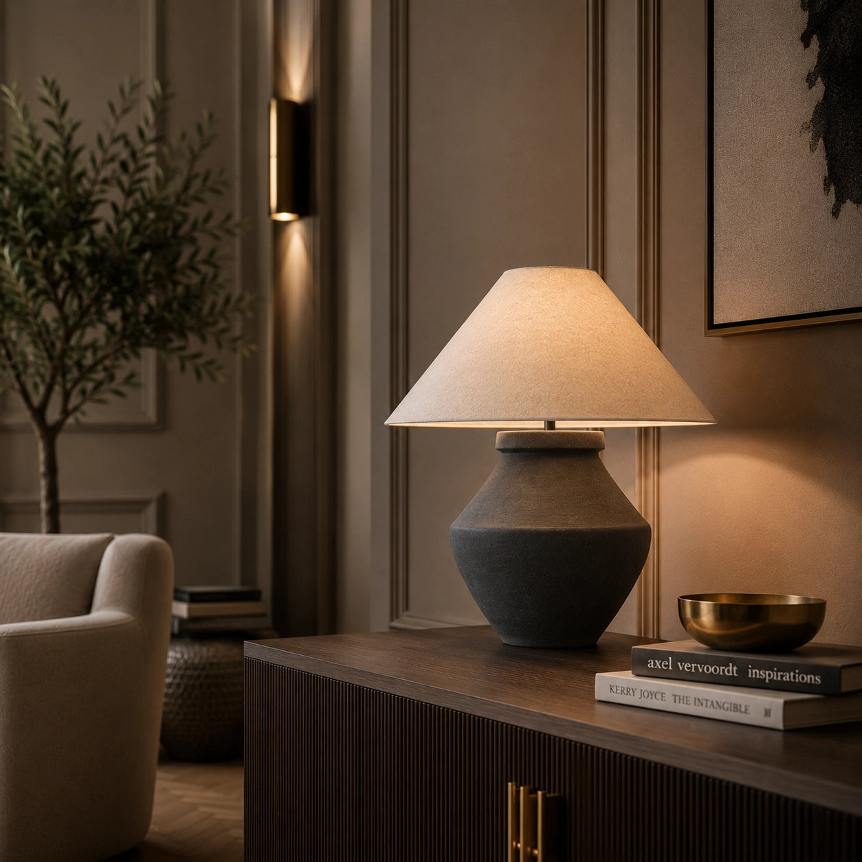 Designer table lamp with sculptural black base and linen lampshade