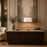 Modern gold table lamp with white tapered shade and black edging