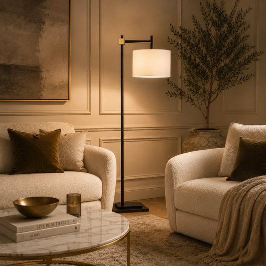 Prism black floor lamp with white drum shade and brass accent