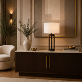 Luxury table lamp with geometric brass base and white fabric shade